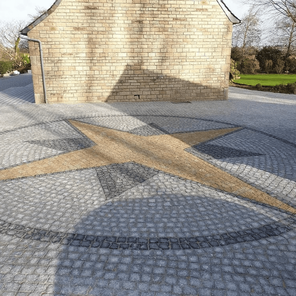 cobblestone driveway with intricate compass design