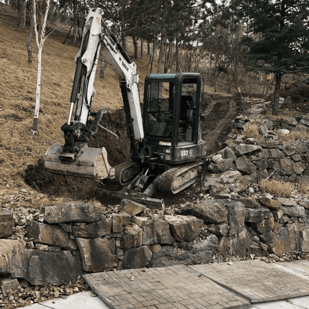 excavator grading a pathway