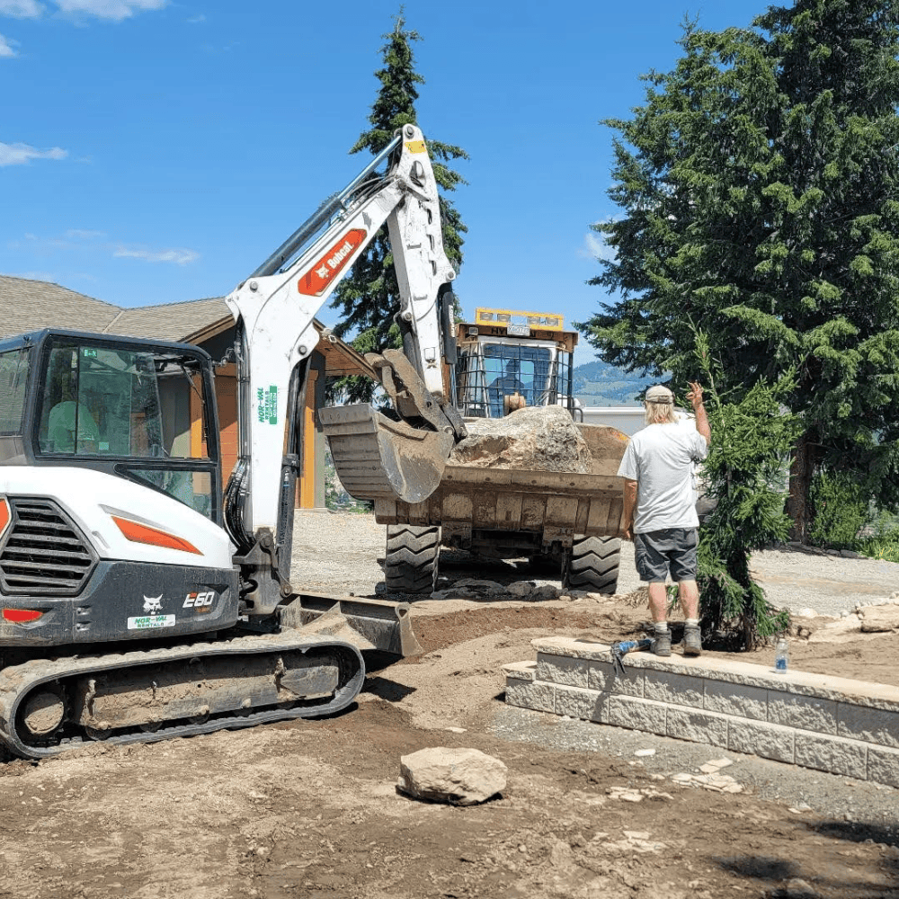 excavator loading boulders
