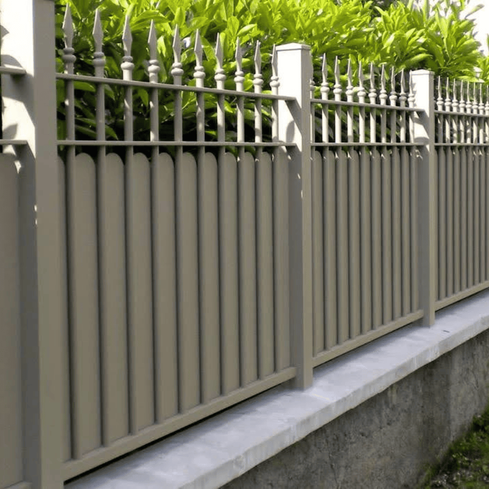 Masonry wall and ornate fence