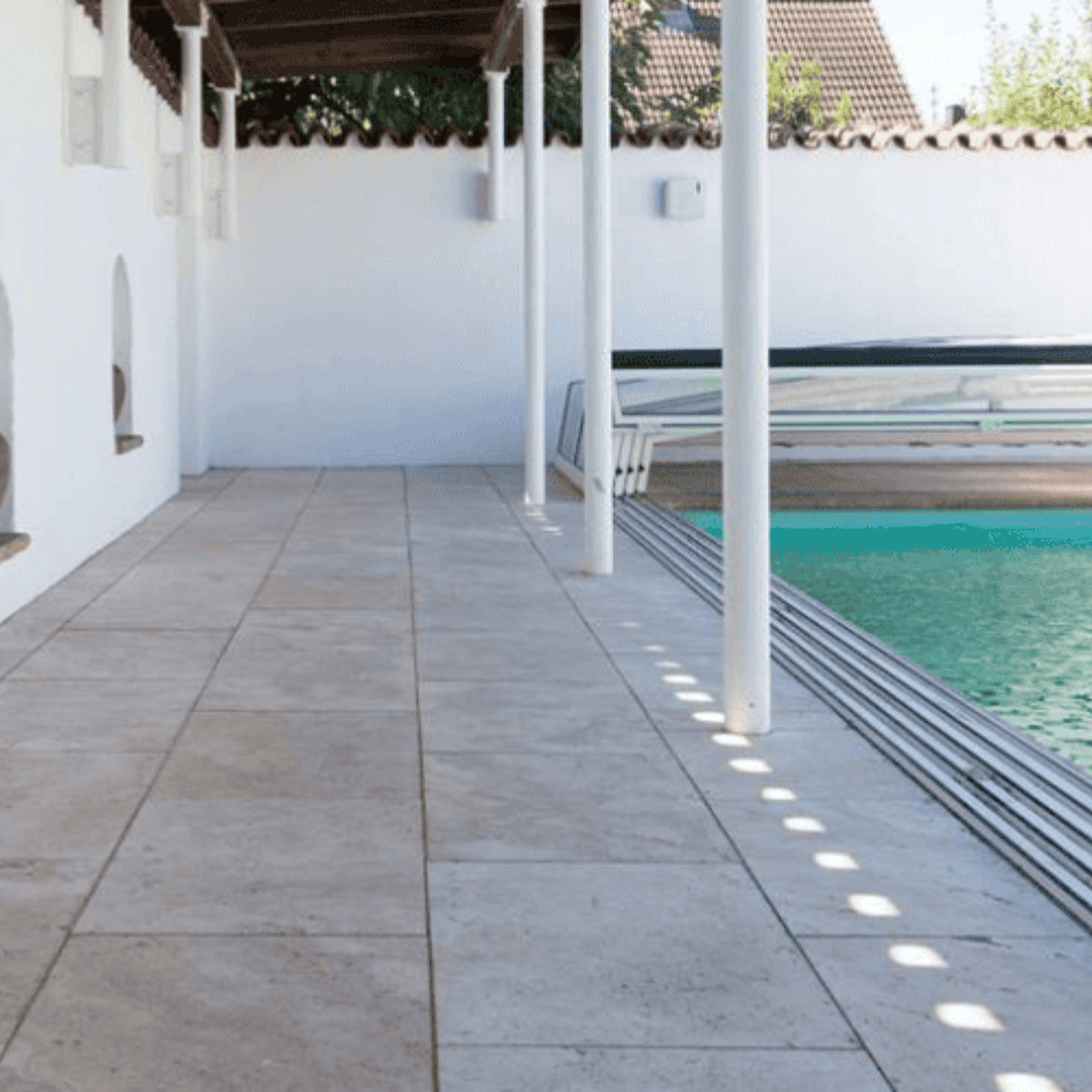 stone tiled courtyard & pool coping