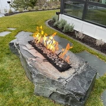 gas fire pit cut into natural stone