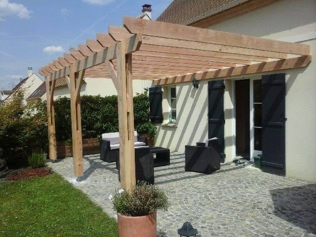 lean-to wooden pergola over paved patio